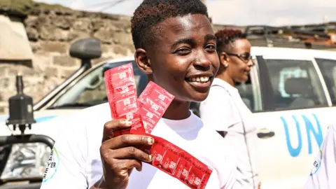 James Wakibia/Getty Images A man with condoms in Nakuru, Kenya - Tuesday 26 September 2023
