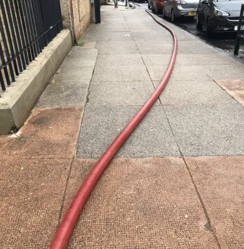 Hose on Glasgow street pavements