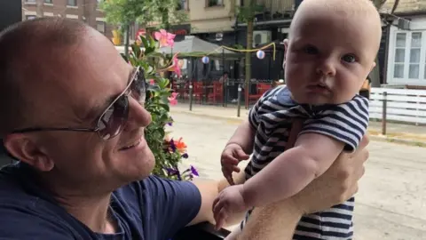 Nate Van Kampen Nate Van Kampen hold his baby son