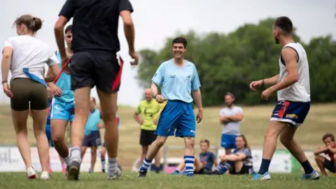 Getty Images Aurélien Pradié playing rugby on the campaign trail