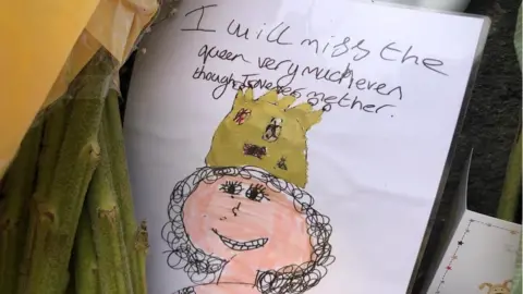 BBC A card left in tribute to Queen Elizabeth II