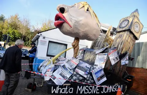 REUTERS/Toby Melville An effigy of Boris Johnson, urinating onto newspapers, is set to be burned during the Lewes bonfire celebrations