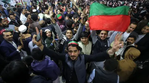 EPA supporters of Pakistan Tehreek-e-Insaf (PTI) party led by convicted former Prime Minister Imran Khan celebrate unofficial provisional partial results at the end of voting day (February 8, 2024) (Peshawar, Pakistan)