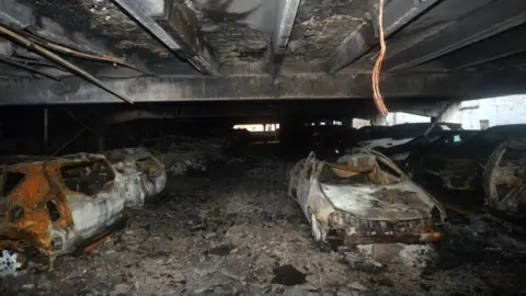 Merseyside Fire and Rescue Service Vehicles damaged in car park fire