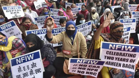 Getty Images Women from Shaheen Bagh gather at the Jantar Mantar on the second anniversary of Shaheen Bagh protest, the infamous protests against the Citizenship Amendment Act (CAA) on 16 December 2021