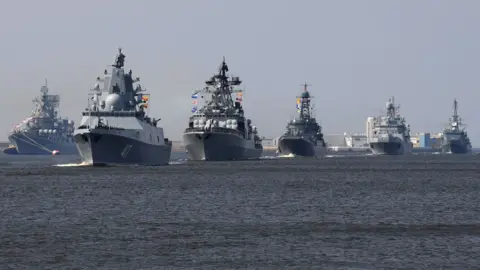 Getty Images Russian fleet, led by the warship Admiral Gorshkov