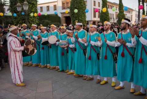 EPA Ahwach musicians perform and celebrate with members of the community on the eve of the 2969th Amazigh New Year near the parliament in the capital of Rabat, Morocco, 12 January 2019. After more than eight years of devoting Berbers as an official language alongside Arabic, voices in Morocco are increasingly calling for a public holiday to celebrate the Berber New Year.