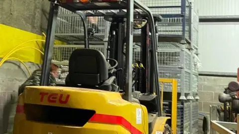 Gary Middleton forklift truck blocking sandbags at Derry depot