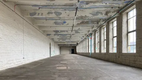 The empty room in Salts Mills which will be the Peace Museum 