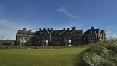 Getty Images A still image of the golf house at the Trump International Golf Links Ireland site in Doonbeg County Clare. It is a stately, grey three-storey building and sits on the edge of the golf green.