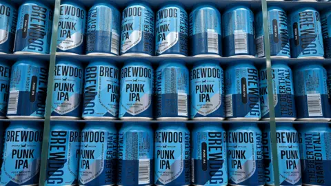 Getty Images Blue cans of Brewdog Punk IPA stacked for delivery 