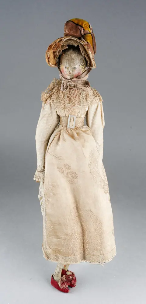 Irita Marriott Auctioneers and Valuers In full costume, a 19th Century peg doll