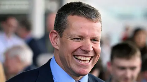 Getty Images A smiling Rhun ap Iorwerth on the steps of the Senedd building 