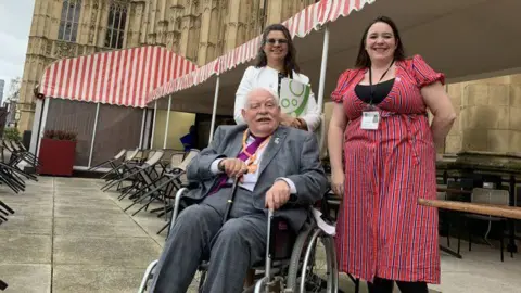 Sunlight Trust Robert Taylor with Meirelle Frost of the Sunlight Trust and trustee Lia Mandaracas on the terrace of the House of Commons.