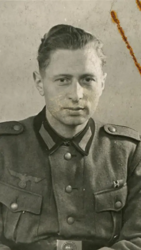 Jersey Heritage A black and white photo of a World War Two German soldier in uniform.