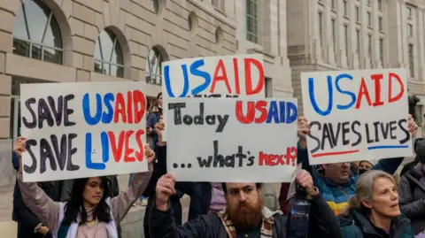 Getty Images Protesters demonstrate in support of USAID outside the agency headquarters in Washington, DC.