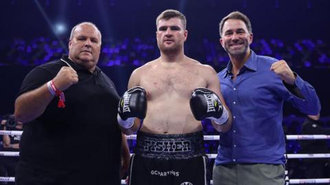 Johnny Fisher poses with his dad Big John Fisher and promoter Eddie Hearn