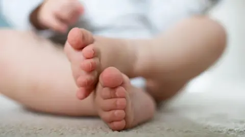 A close up picture of a baby's feet