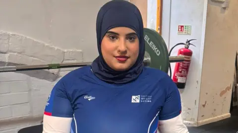 Doaa Shayea in blue British Weight Lifting kit