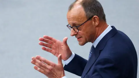 Reuters Friedrich Merz di Bundestag pada 13 Maret 2025