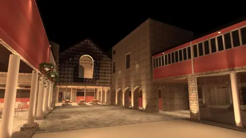 The Buttermarket in its building site stage. The middle is open space. There is a lot of exposed brick and pillars. 