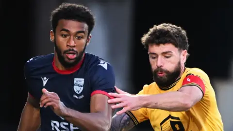 Ross County's Elijah Campbell and Livingston's Jamie Brandon