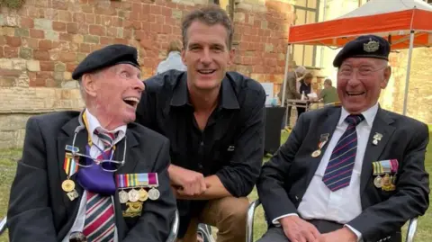 Gloucester History Festival Historian Dan Snow in the centre of the picture between Korean War veterans Brian Hamblett on the right and Tommy Clough on the left