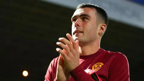 Motherwell's Lennon Miller celebrates his side's 3-0 win following a William Hill Premiership match between Motherwell and Kilmarnock at Fir Park