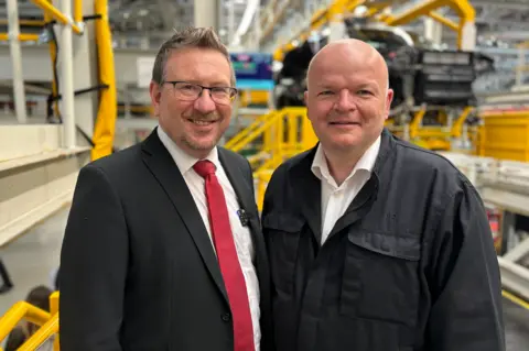 Public health minister Andrew Gwynne with Jaguar Land Rover operations director Russell Leslie