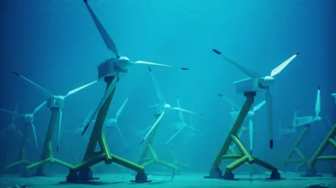 Getty Images A stock image of an array of turbines standing on the sea bed