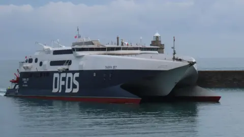 The side of a large DFDS ship.