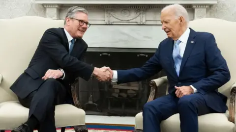 Getty Images Sir Keir Starmer shares a handshake with Joe Biden at the Oval Office in the White House on 10 July 2024