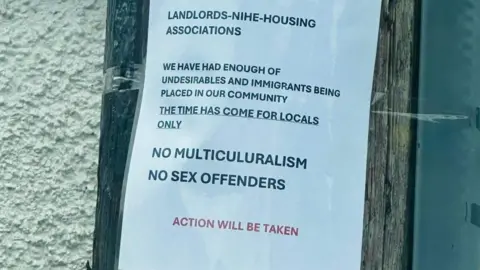 A sign warning landlords to house "locals only" was stuck to a pole