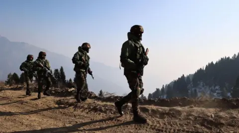 Getty Images Indian army soldiers are patrolling the Line of Control (LoC) between Pakistan and India in Uri Sector, Jammu and Kashmir, India, on January 24, 2024.