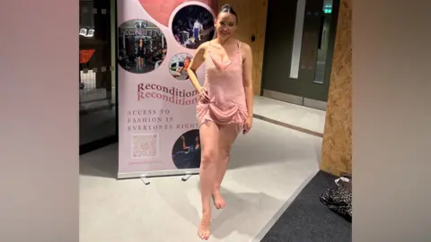 Georgie Leckey Georgie Leckey, dressed for a dance performance in a light pink costume