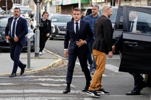 Reuters macron in Noumea