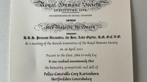 Linkedin A photo of the award issued by the Royal Humane Society. It's a piece of paper that details when it was given and who it was given to.