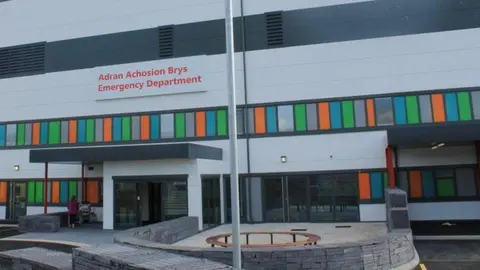 Betsi Cadwaladr health board A grey building with an 'Emergency Department' sign in red writing