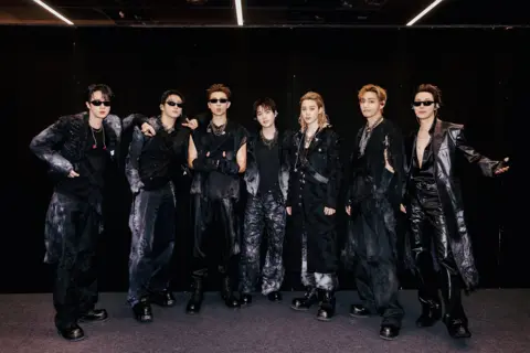 HYBE / Big Hit Music BTS backstage in London wearing black outfits