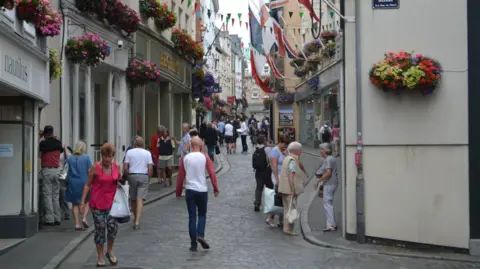 BBC People walking in Guernsey's High Street
