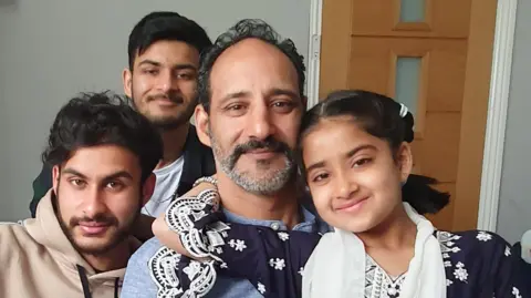 Parvina Khan  Sfiyah with her father, Gulafhfaq and her brothers Kaden and Haider. 