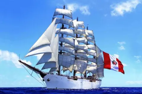 Sail Training International Tall ship - BAP Union - with white hull and sails, flying red and white Peru flag.