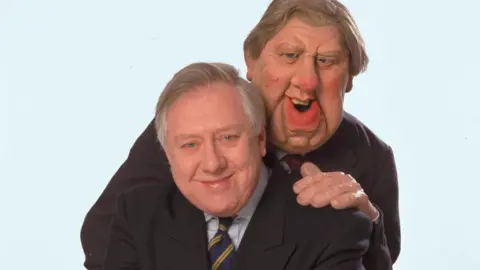 Getty Images Roy Hattersley with his satirical Spitting Image puppet