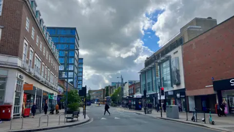 David Freezer/BBC A view of a city centre street. To the left is a small Sainsbury's.