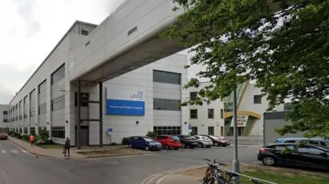 Hull's Women's and Children's Hospitals - a large white, multi-storey building with an enclosed bridge connecting it to the main hospital