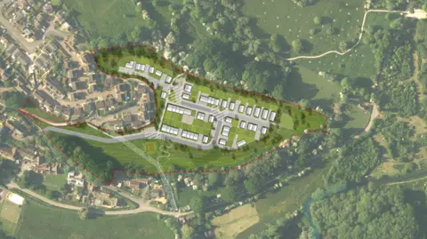 An aerial image of several homes near trees and homes