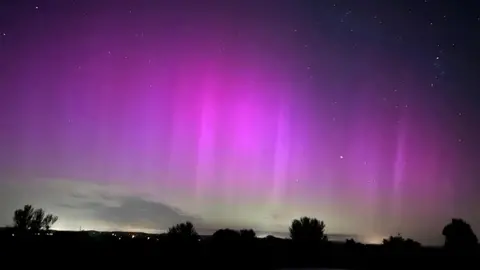 Nigel Ashley Purple and green skies over Ilminster 