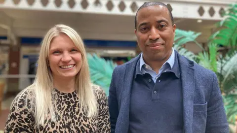 Danica Clements and Dane Cummings from the Acorn Property Group look at the camera