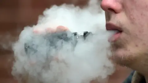 Nicholas T Ansell/PA Wire Male vaping