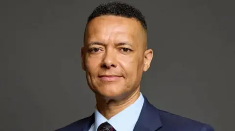 UK Parliament Clive Lewis wearing a suit and tie